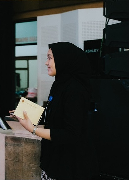 Ore team member working beside the stage